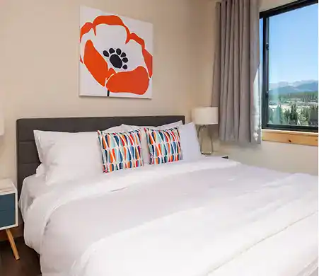 Cozy bedroom with colorful decor.