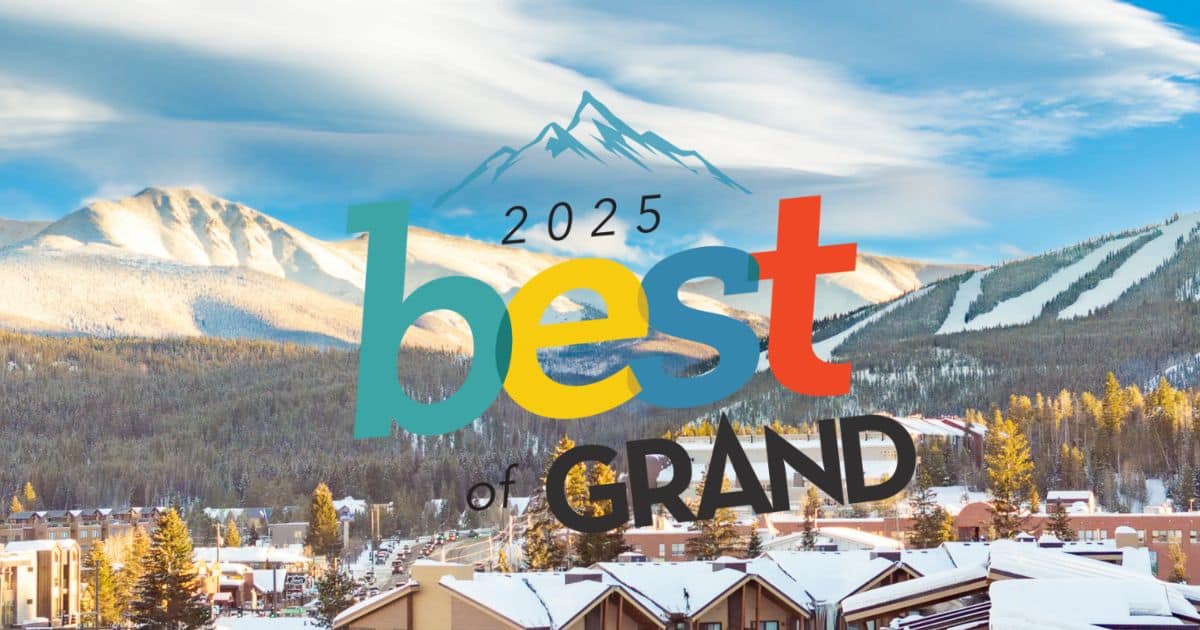 Snow-covered mountain town with the text “2025 Best of Grand” overlaid on the image.